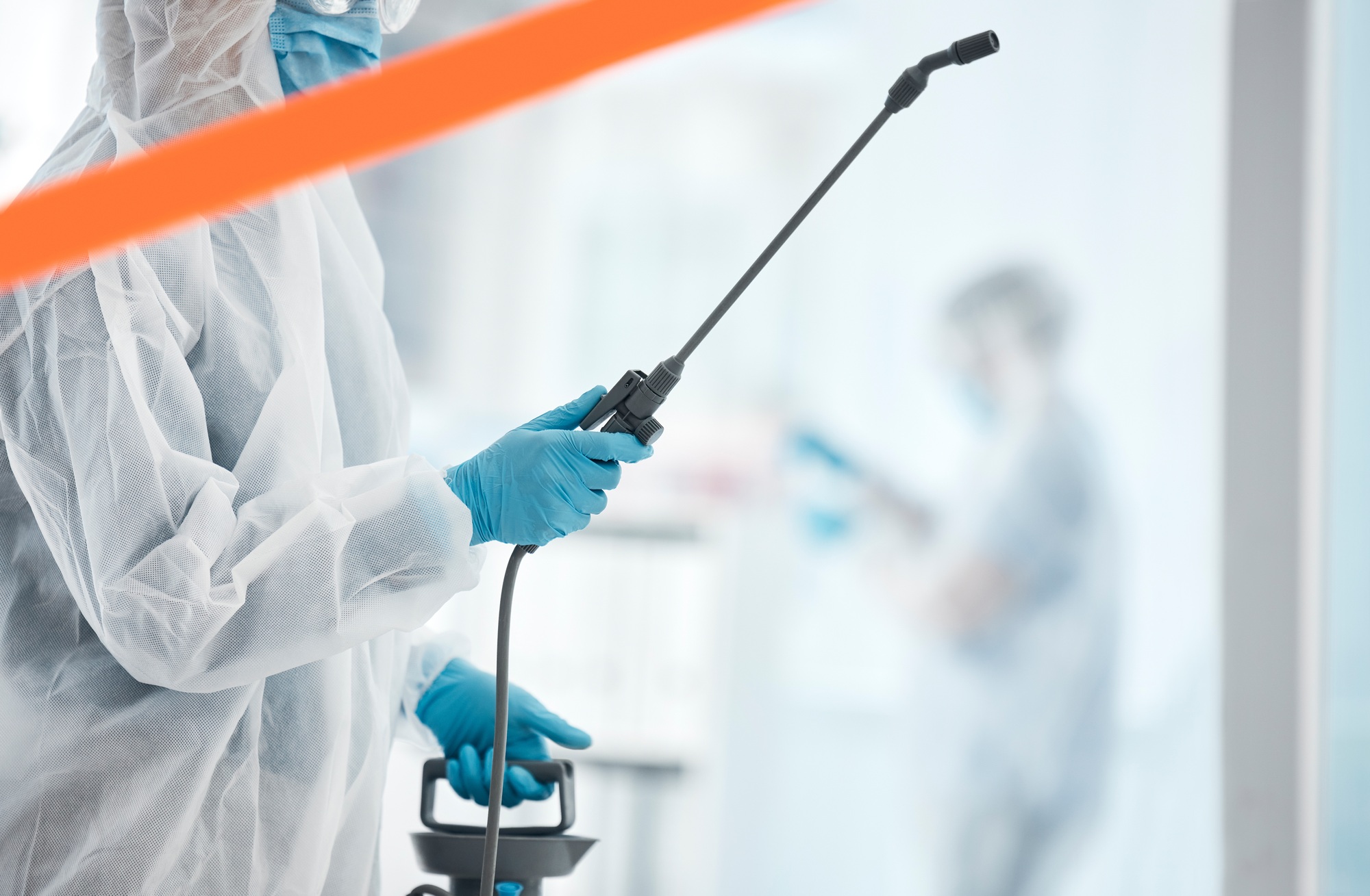 Hospital, cleaning and covid sanitation by professional cleaner spray, disinfect and bacteria preve